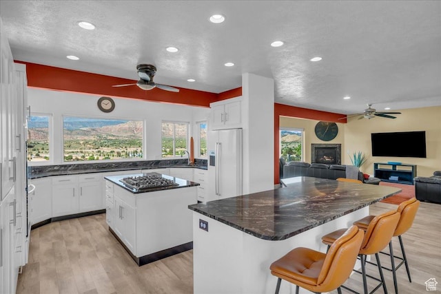 458 E Homespun Cir, Leeds, UT 84746 - kitchen featuring recessed lighting, stainless steel gas stovetop, ceiling fan, high end fridge, and a kitchen island