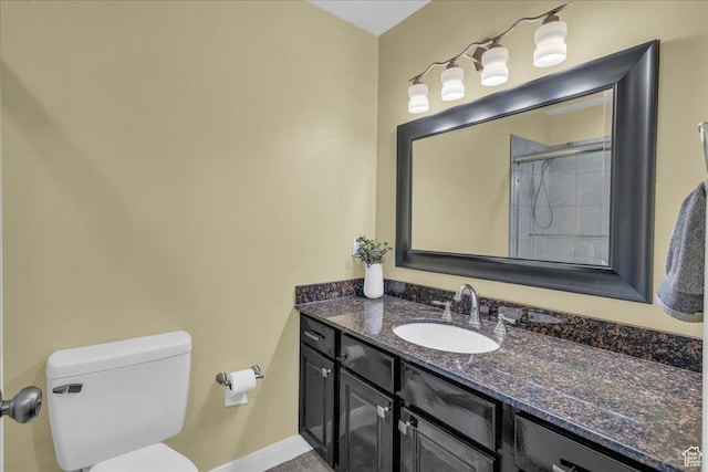 458 E Homespun Cir, Leeds, UT 84746 - full bathroom featuring baseboards, vanity, a shower with door, and toilet