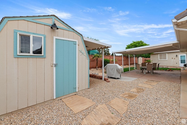 view of shed featuring a fenced backyard