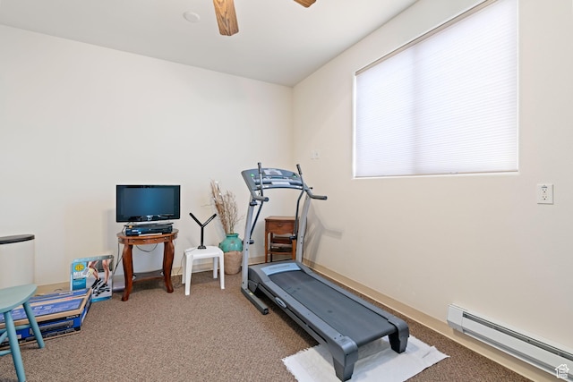 workout area featuring carpet flooring, baseboard heating, and ceiling fan