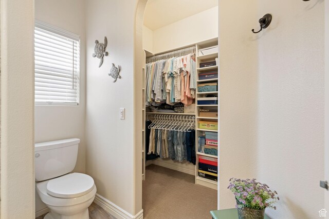 161 E 625th Cir S, Ivins, UT 84738 - bathroom featuring a walk in closet, toilet, and baseboards