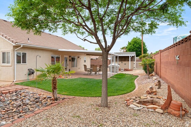 161 E 625th Cir S, Ivins, UT 84738 - rear view of property featuring a patio area, a lawn, a fenced backyard, and stucco siding