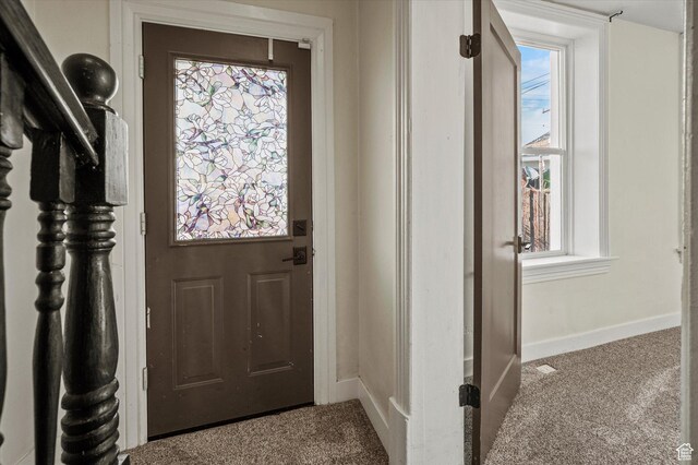 204 S 500 E, Ogden, UT 84404 - doorway to outside with carpet floors, a healthy amount of sunlight, and baseboards