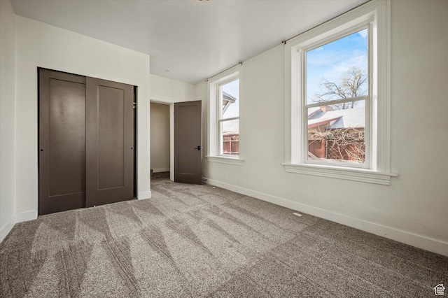204 S 500 E, Ogden, UT 84404 - unfurnished bedroom featuring carpet, a closet, and baseboards