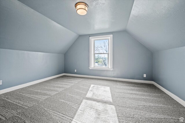 204 S 500 E, Ogden, UT 84404 - bonus room with vaulted ceiling, a textured ceiling, baseboards, and carpet
