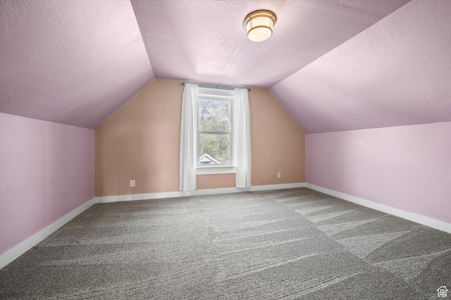 204 S 500 E, Ogden, UT 84404 - additional living space featuring carpet, vaulted ceiling, baseboards, and a textured ceiling