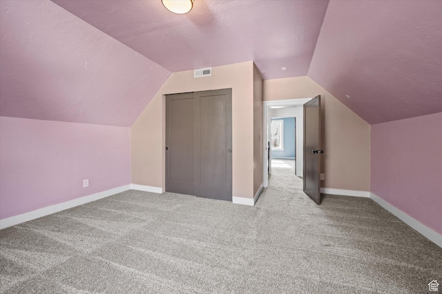204 S 500 E, Ogden, UT 84404 - additional living space with baseboards, vaulted ceiling, visible vents, and carpet flooring