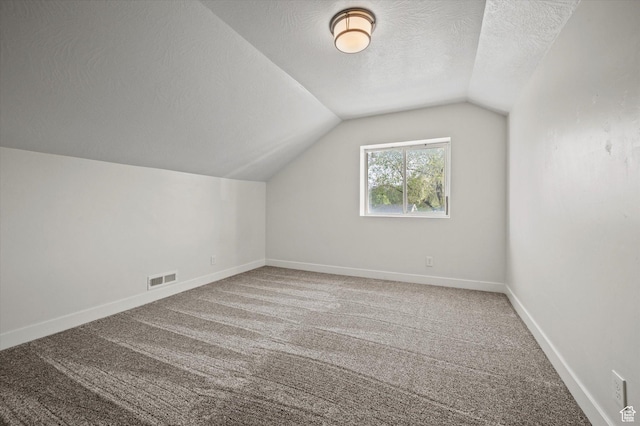 204 S 500 E, Ogden, UT 84404 - bonus room with a textured ceiling, vaulted ceiling, visible vents, and carpet flooring