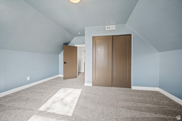 204 S 500 E, Ogden, UT 84404 - additional living space with baseboards, vaulted ceiling, visible vents, and carpet floors