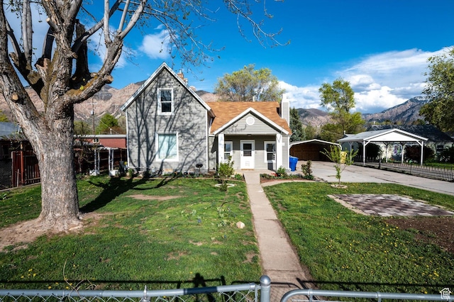204 S 500 E, Ogden, UT 84404 - view of front of home with a front yard, a detached carport, a chimney, and fence