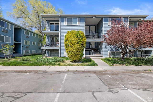 3512 S 300 E Unit P, Salt Lake City, UT 84115 - view of front of property featuring uncovered parking and a balcony