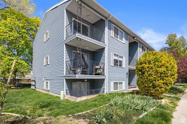 3512 S 300 E Unit P, Salt Lake City, UT 84115 - back of house featuring a balcony and a yard
