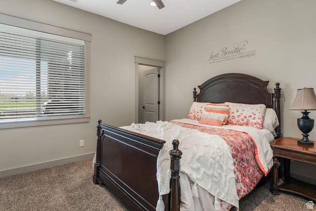 carpeted bedroom featuring a ceiling fan and baseboards