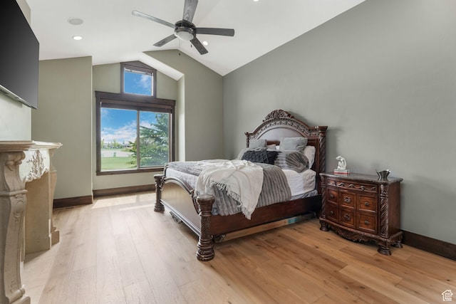 bedroom featuring vaulted ceiling, baseboards, ceiling fan, and light wood-style flooring