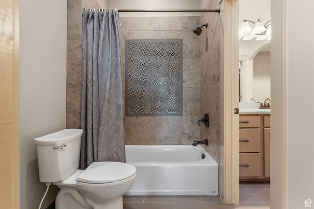bathroom featuring tile patterned floors, vanity, shower / bathtub combination with curtain, and toilet