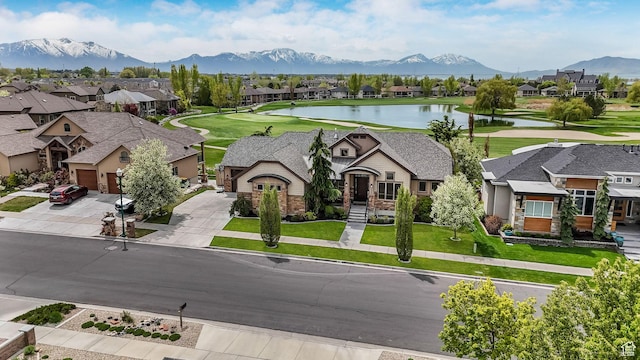 bird's eye view with a water and mountain view and a residential view