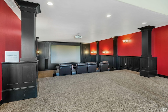 carpeted home theater room with decorative columns, visible vents, and recessed lighting