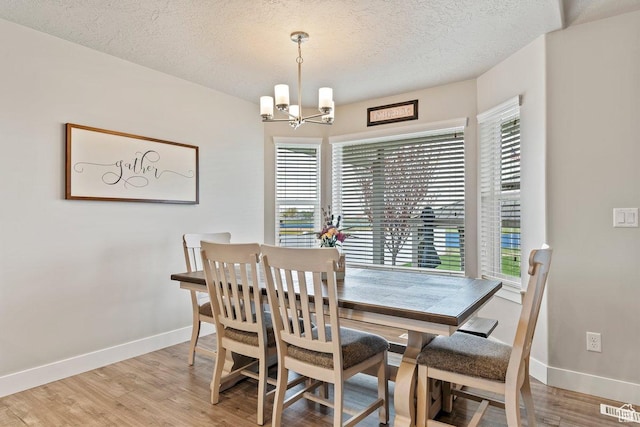 1795 N 4475 W, Plain City, UT 84404 - dining room featuring baseboards, a notable chandelier, visible vents, and light wood-type flooring