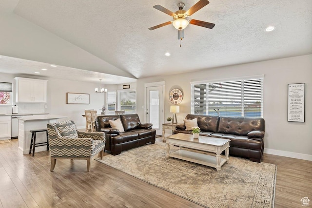 1795 N 4475 W, Plain City, UT 84404 - living area with ceiling fan with notable chandelier, a textured ceiling, light wood-style floors, and recessed lighting