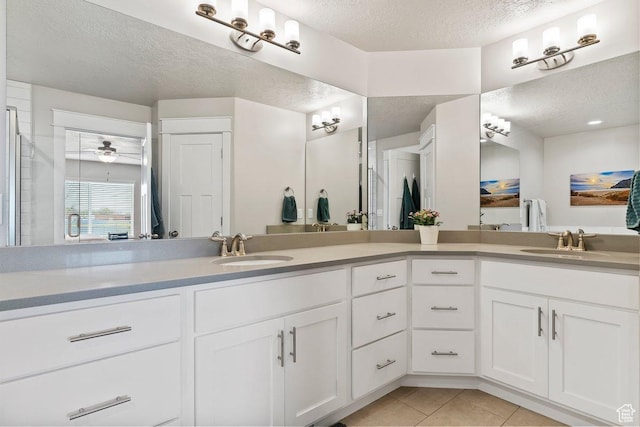 1795 N 4475 W, Plain City, UT 84404 - full bathroom featuring tile patterned floors, a sink, a textured ceiling, and double vanity