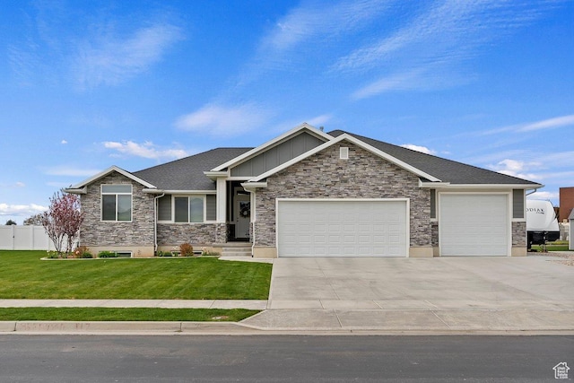 craftsman-style house with a front lawn, an attached garage, board and batten siding, driveway, and stone siding
