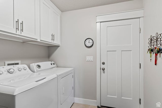 1795 N 4475 W, Plain City, UT 84404 - laundry room with baseboards, cabinet space, washer and clothes dryer, and light tile patterned floors