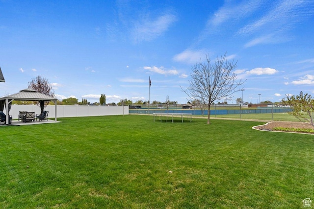 1795 N 4475 W, Plain City, UT 84404 - view of yard featuring a fenced backyard, a gazebo, a patio area, and a trampoline