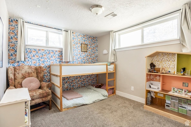 9466 S Indian Ridge Dr E, Sandy, UT 84092 - bedroom featuring wallpapered walls, a textured ceiling, carpet, and baseboards