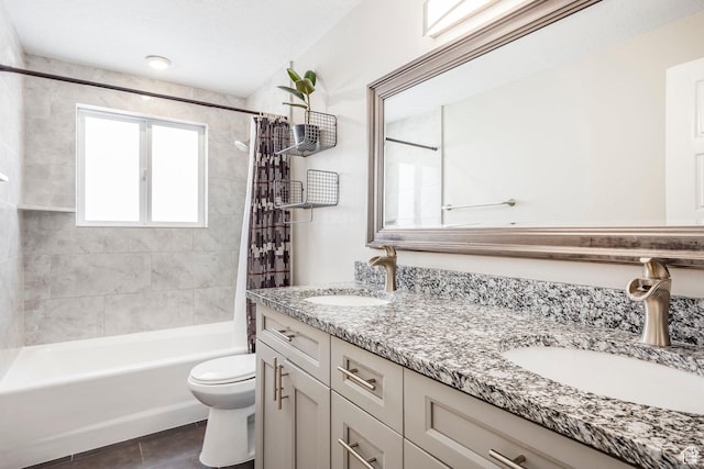 9466 S Indian Ridge Dr E, Sandy, UT 84092 - full bath with double vanity, toilet, shower / bath combo with shower curtain, and tile patterned floors