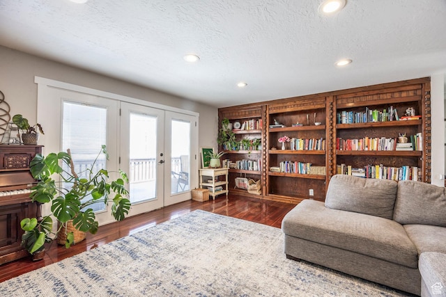 9466 S Indian Ridge Dr E, Sandy, UT 84092 - living area featuring wood finished floors, french doors, recessed lighting, and a textured ceiling