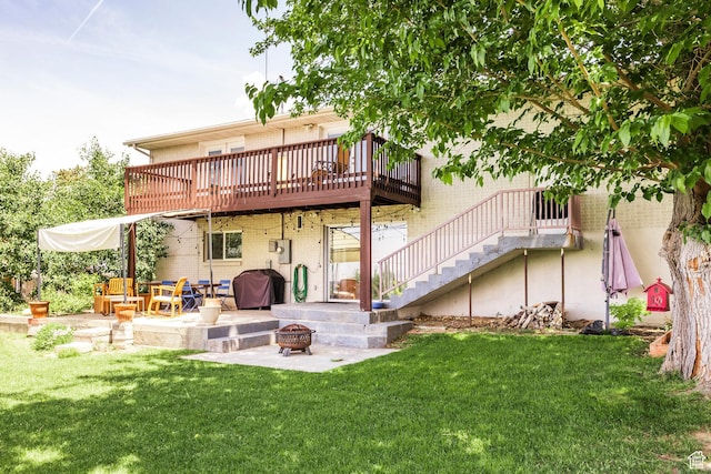 9466 S Indian Ridge Dr E, Sandy, UT 84092 - rear view of property featuring a fire pit, brick siding, a patio area, a yard, and stairway