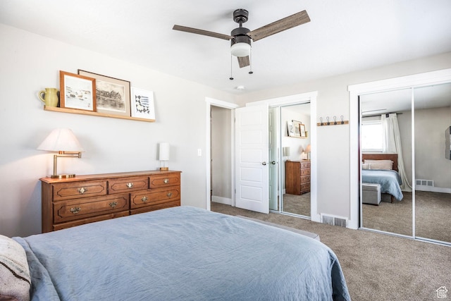 9466 S Indian Ridge Dr E, Sandy, UT 84092 - carpeted bedroom with multiple closets, ceiling fan, and baseboards