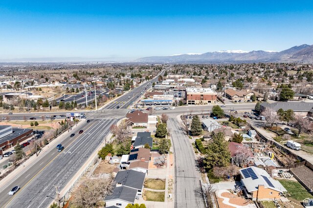 9466 S Indian Ridge Dr E, Sandy, UT 84092 - aerial overview of property's location with a main thoroughfare, mountains, and nearby suburban area