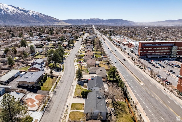 9466 S Indian Ridge Dr E, Sandy, UT 84092 - aerial perspective of suburban area featuring a major roadway and mountains