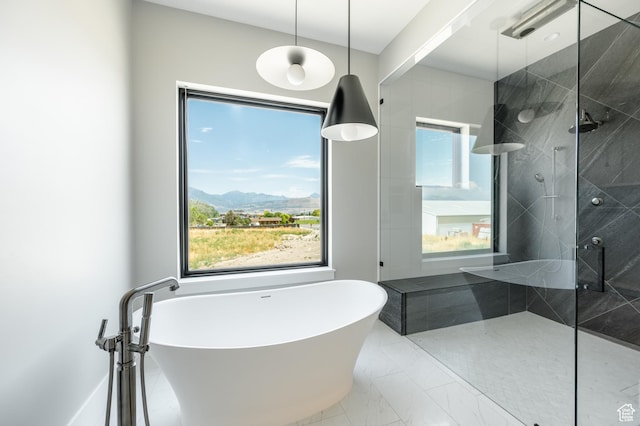 3640 W Kenna Ln Unit 101, Bluffdale, UT 84065 - full bathroom with walk in shower, marble finish floor, a freestanding bath, and a mountain view