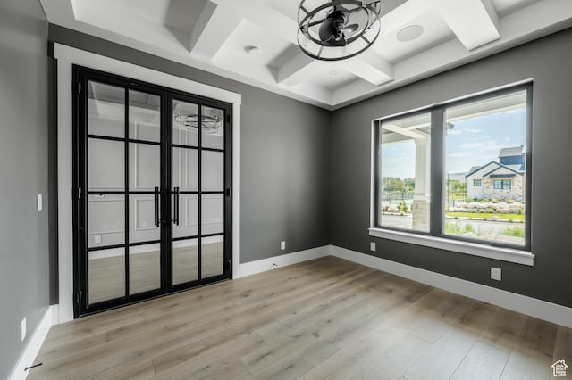 3640 W Kenna Ln Unit 101, Bluffdale, UT 84065 - empty room featuring baseboards, coffered ceiling, beam ceiling, and light wood-style floors