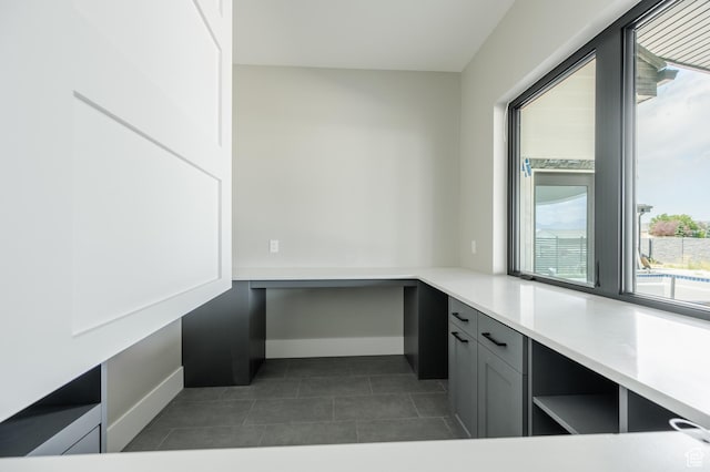 3640 W Kenna Ln Unit 101, Bluffdale, UT 84065 - unfurnished office featuring dark tile patterned floors and baseboards