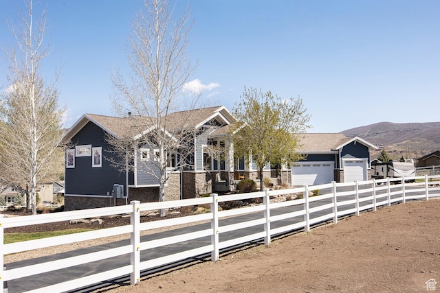 1621 S 4800 E, Heber City, UT 84032 - view of front of house featuring a garage, stone siding, concrete driveway, and a mountain view