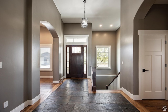 1621 S 4800 E, Heber City, UT 84032 - entryway featuring baseboards, healthy amount of natural light, arched walkways, stone tile floors, and recessed lighting
