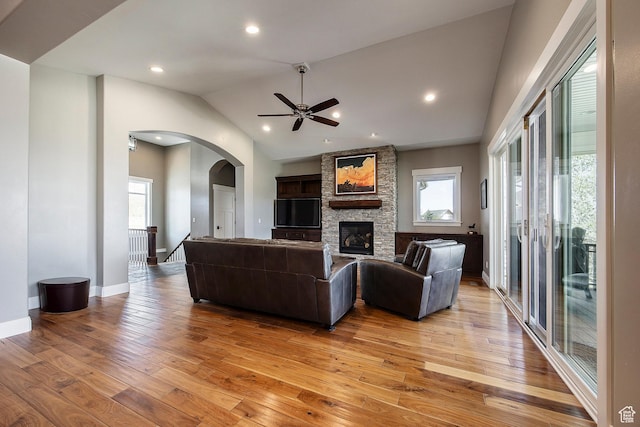 1621 S 4800 E, Heber City, UT 84032 - living room with healthy amount of natural light, arched walkways, light wood finished floors, lofted ceiling, and ceiling fan