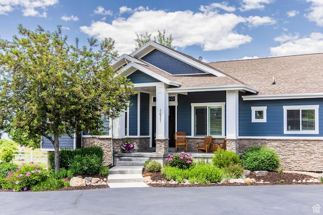 1621 S 4800 E, Heber City, UT 84032 - craftsman house featuring stone siding, a porch, and roof with shingles