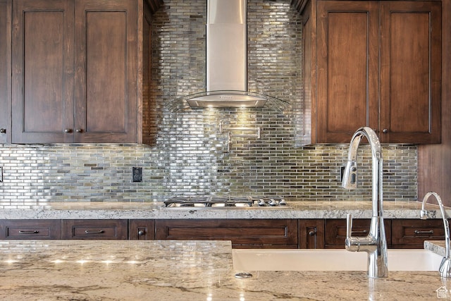 1621 S 4800 E, Heber City, UT 84032 - kitchen with wall chimney exhaust hood, stainless steel gas cooktop, tasteful backsplash, and light stone counters