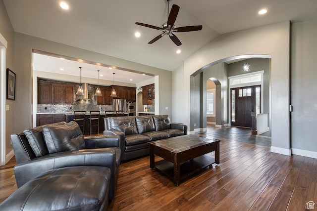 1621 S 4800 E, Heber City, UT 84032 - living room featuring arched walkways, ceiling fan, dark wood-style floors, baseboards, and lofted ceiling
