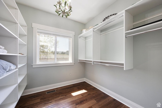 1621 S 4800 E, Heber City, UT 84032 - spacious closet featuring dark wood-type flooring and a chandelier