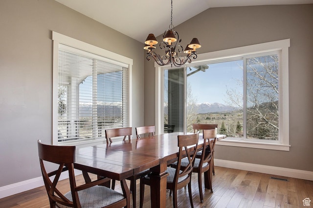 1621 S 4800 E, Heber City, UT 84032 - dining room with vaulted ceiling, baseboards, a chandelier, wood finished floors, and a mountain view