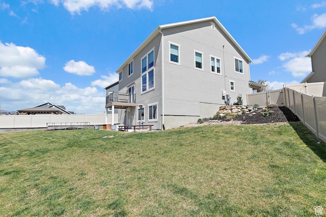 exterior space featuring a lawn and a fenced backyard