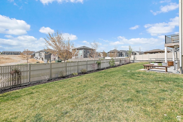 view of yard with a residential view and a fenced backyard
