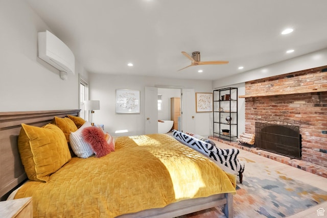 bedroom featuring a brick fireplace and recessed lighting
