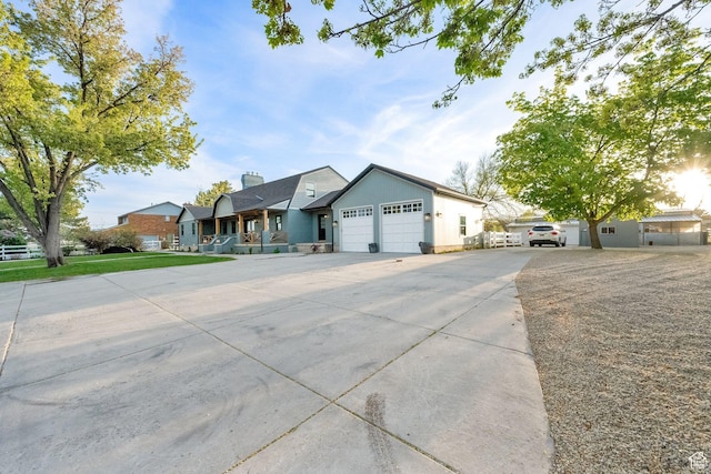 ranch-style home with a garage and concrete driveway