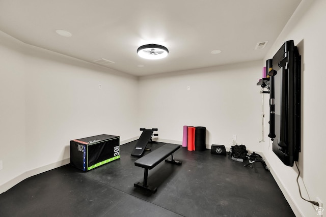 exercise area with baseboards and visible vents